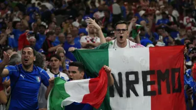 Italian fans cheer their teams during a Group B match between Croatia and Italy at the Euro 2024 soccer tournament in Leipzig, Germany, Monday, June 24, 2024. (AP Photo/Petr David Josek)