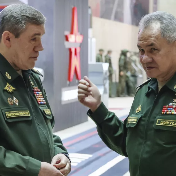 FILE - Russian Defense Minister Sergei Shoigu, right, gestures as he speaks to Russian Chief of General Staff Gen. Valery Gerasimov prior to a meeting Russian President Vladimir Putin with the top military brass in Moscow, Russia, Tuesday, Dec. 19, 2023. The International Criminal Court issued arrest warrants Tuesday for Russia's former defense minister and its military chief of staff for attacking civilian targets in Ukraine.(Sputnik, Kremlin Pool Photo via AP, File)