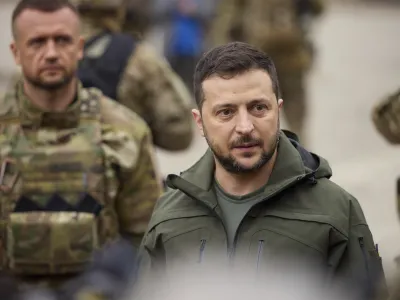 14 September 2022, Ukraine, Izium: Ukrainian President Volodymyr Zelensky (R) takes a walking tour of the liberated city of Izium. Zelensky made a surprise visit to the city recaptured from Russia during a Ukrainian counter-offensive. Photo: -/Ukrainian Presidential Press Office via Planet Pix via ZUMA Press Wire/dpa