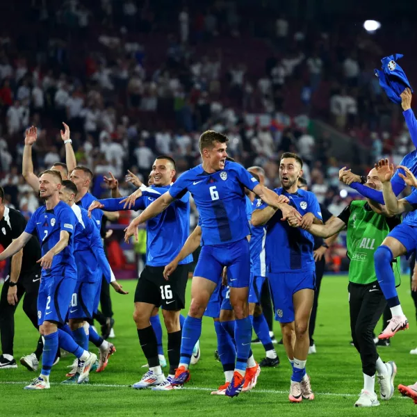 Soccer Football - Euro 2024 - Group C - England v Slovenia - Cologne Stadium, Cologne, Germany - June 25, 2024 Slovenia's Jaka Bijol celebrates with teammates after the match REUTERS/Lee Smith