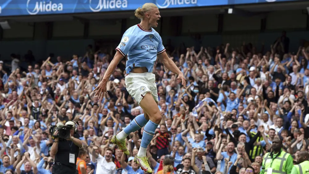 Manchester City's Erling Haaland celebrates scoring his side fourth goal of the game to complete his hat trick during the English Premier League match between Crystal Palace and Manchester City at the Etihad Stadium in Manchester, England, Saturday Aug. 27, 2022. (Nick Potts/PA via AP)