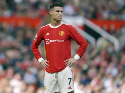 FILE- Manchester United's Cristiano Ronaldo stands on the pitch during the English Premier League soccer match between Manchester United and Norwich City at Old Trafford stadium in Manchester, England, on April 16, 2022. Amid doubts over Ronaldo's future at the club, Manchester United manager Erik ten Hag has said that Cristiano Ronaldo is "not for sale." The team is in Thailand for a preseason tour but the 37-year-old forward didn't make the trip due to an unspecified family issue. (AP Photo/Jon Super, File)