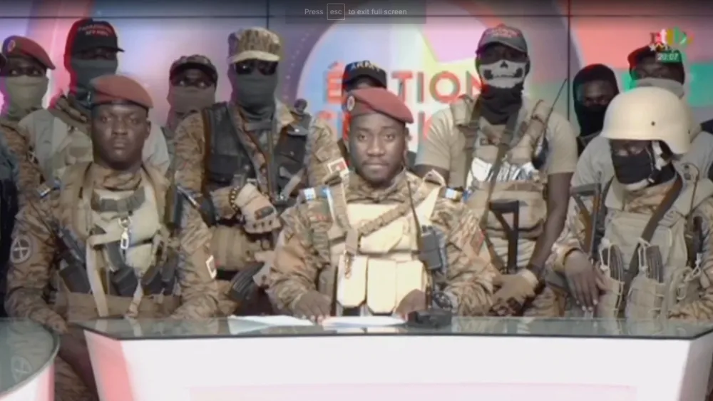 Kiswensida Farouk Aziz Sorgho announces on television that army captain Ibrahim Traore has ousted Burkina Faso's military leader Paul-Henri Damiba and dissolved the government and constitution, in Ouagadougou, Burkina Faso, September 30, 2022, in this still image obtained from a video. Radio Television Burkina Faso/Handout via REUTERS THIS IMAGE HAS BEEN SUPPLIED BY A THIRD PARTY. NO RESALES. NO ARCHIVES. MANDATORY CREDIT. BURKINA FASO OUT. NO COMMERCIAL OR EDITORIAL SALES IN BURKINA FASO