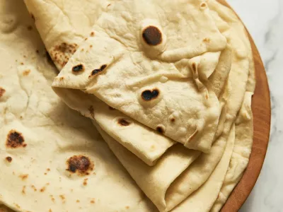 Soft lavash bread on white background. Homemade freshy baked lavash bread is perfect for kebabs, shawarma and other dishes. Only water, yeast, flour and salt. High quality photo / Foto: Alexbai