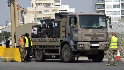 A truck carrying Gaza aid is about to enter a U.S ship, at the port of Larnaca, Cyprus, Wednesday, June 26, 2024. An official with the U.S. humanitarian assistance agency USAID says thousands of tons of food, medicines and other aid piled up on a Gaza beach isn't reaching those in need because of a dire security situation on the ground where truck drivers are either getting caught in the crossfire or have their cargo seized by "gang-like" groups. (AP Photo/Petros Karadjias)