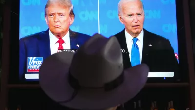 Roger Strassburg, of Scottsdale, Ariz., wears a cowboy hat as he watches the presidential debate between President Joe Biden and Republican presidential candidate former President Donald Trump at a debate watch party Thursday, June 27, 2024, in Scottsdale, Ariz. (AP Photo/Ross D. Franklin)