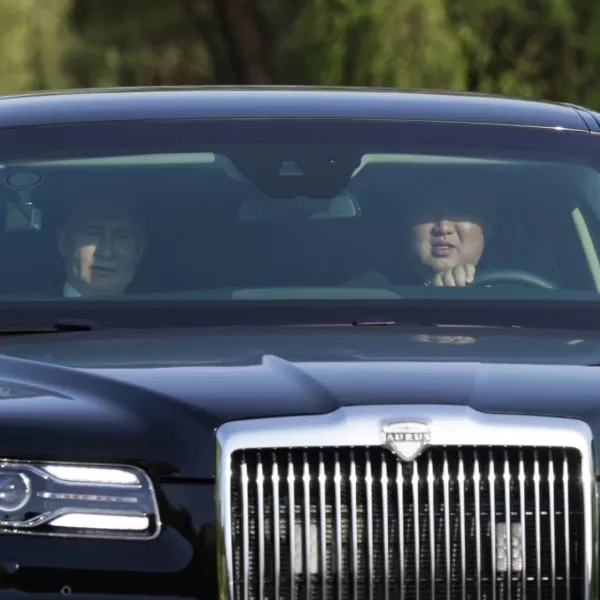 Russia's President Vladimir Putin and North Korea's leader Kim Jong Un ride an Aurus car in Pyongyang, North Korea June 19, 2024. Sputnik/Gavriil Grigorov/Pool via REUTERS ATTENTION EDITORS - THIS IMAGE WAS PROVIDED BY A THIRD PARTY.