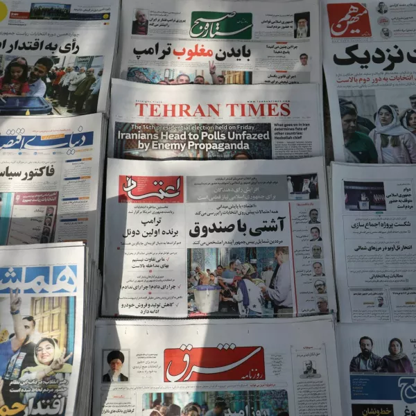 Newspapers with a cover picture of Iran's presidential election are seen in Tehran, Iran June 29, 2024. Majid Asgaripour/WANA (West Asia News Agency) via REUTERS ATTENTION EDITORS - THIS PICTURE WAS PROVIDED BY A THIRD PARTY.