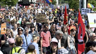 People gather to demonstrate against the AfD national party conference in Essen, Germany, Saturday June 29, 2024. The far-right Alternative for Germany party is holding a convention in the western city of Essen and large-scale protests against the party are taking place. (Henning Kaiser/dpa via AP)