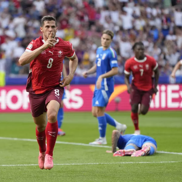 Switzerland's Remo Freuler (8) celebrates after scoring during a round of sixteen match between Switzerland and Italy at the Euro 2024 soccer tournament in Berlin, Germany, Saturday, June 29, 2024. (AP Photo/Matthias Schrader)