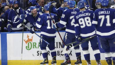 May 23, 2022; Tampa, Florida, USA; Tampa Bay Lightning left wing Ondrej Palat (18) is congratulated by teammates as he scores an empty net goal against the Florida Panthers during the third period at Amalie Arena. Mandatory Credit: Kim Klement-USA TODAY Sports