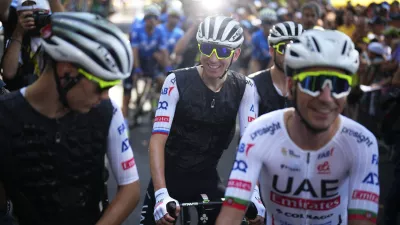 Slovenia's Tadej Pogacar, wearing a cooling vest, waits for the start of the second stage of the Tour de France cycling race over 199.2 kilometers (123.8 miles) with start in Cesenatico and finish in Bologna, Italy, Sunday, June 30, 2024. (AP Photo/Daniel Cole)