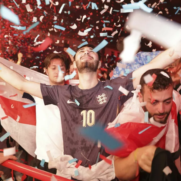 England fans celebrate at the Diecast, Manchester, England, Sunday, June 30, 2024 during the screening of a UEFA Euro 2024, round of sixteen soccer match, between England and Slovakia in Gelsenkirchen, Germany. (Ian Hodgson/PA via AP)