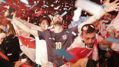 England fans celebrate at the Diecast, Manchester, England, Sunday, June 30, 2024 during the screening of a UEFA Euro 2024, round of sixteen soccer match, between England and Slovakia in Gelsenkirchen, Germany. (Ian Hodgson/PA via AP)