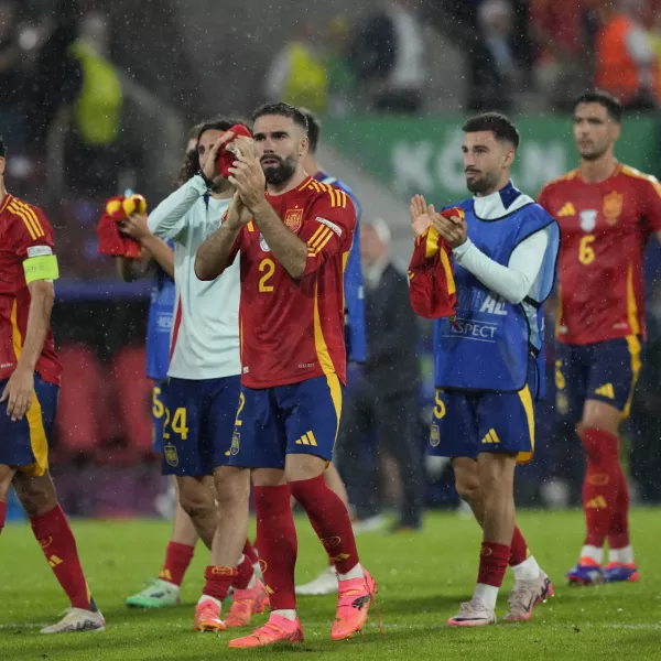 Spain's players react at the end of a round of sixteen match at the Euro 2024 soccer tournament against Georgia in Cologne, Germany, Sunday, June 30, 2024. Spain won the game 4-1. AP Photo/Frank Augstein)