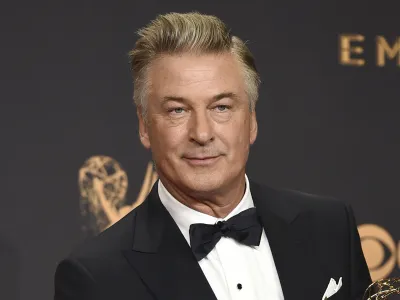 FILE - Alec Baldwin poses in the press room with the award for outstanding supporting actor in a comedy series for "Saturday Night Live" at the 69th Primetime Emmy Awards in Los Angeles on Sept. 17, 2017. The family of a cinematographer shot and killed by Alec Baldwin on the set of the film "Rust" has agreed to settle a lawsuit against Baldwin and the movie's producers, and production will resume on the project. (Photo by Jordan Strauss/Invision/AP, File)