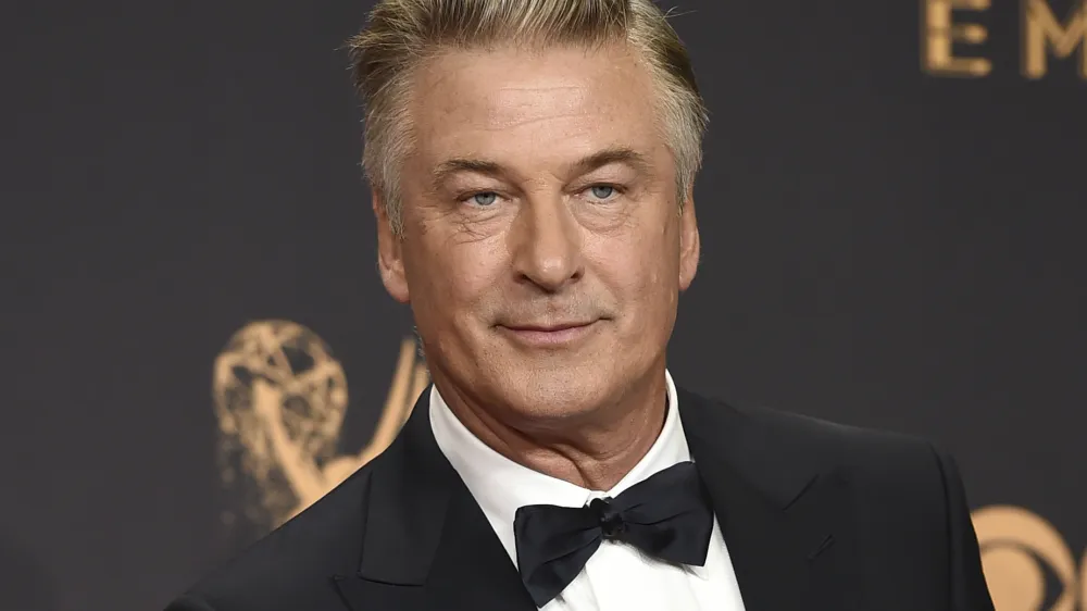 FILE - Alec Baldwin poses in the press room with the award for outstanding supporting actor in a comedy series for "Saturday Night Live" at the 69th Primetime Emmy Awards in Los Angeles on Sept. 17, 2017. The family of a cinematographer shot and killed by Alec Baldwin on the set of the film "Rust" has agreed to settle a lawsuit against Baldwin and the movie's producers, and production will resume on the project. (Photo by Jordan Strauss/Invision/AP, File)