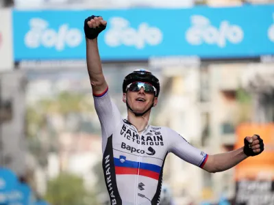 Slovenia's Matej Mohoric celebrates winning the Milano Sanremo (Milan to San Remo) cycling race, in Sanremo, Italy, Saturday, March 19, 2022. (Gian Mattia D'Alberto/LaPresse via AP)