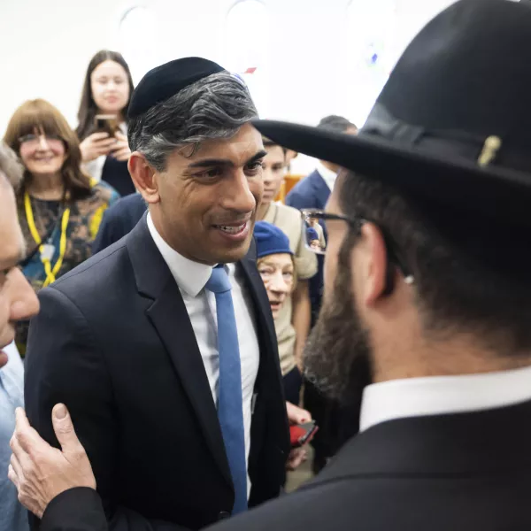 Britain's Prime Minister Rishi Sunak meets locals, during a visit to Machzike Hadath Synagogue, in Golders Green, while on the general election campaign trail, in north west London, Sunday June 30, 2024. (James Manning/Pool Photo via AP)