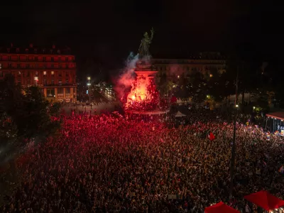 People gather at Republique plaza to protest the far-right National Rally, which came out strongly ahead in first-round legislative elections, Sunday, June 30, 2024, in Paris. France's high-stakes legislative elections propelled the far-right National Rally to a strong but not decisive lead in the first-round vote Sunday, polling agencies projected, dealing another slap to centrist President Emmanuel Macron. (AP Photo/Louise Delmotte)