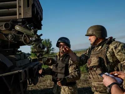 Ukrainian service members of the 110th Colonel-General Marko Bezruchko Separate Mechanized Brigade prepare to fire an RM-70 Vampire multiple launch rocket system towards Russian troops, amid Russia's attack on Ukraine, at a position near a front line in Donetsk region, Ukraine June 30, 2024. REUTERS/Alina Smutko