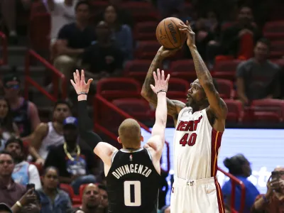 Mar 28, 2022; Miami, Florida, USA; Miami Heat forward Udonis Haslem (40) shoots over Sacramento Kings guard Donte DiVincenzo (0) during the fourth quarter of the game at FTX Arena. Mandatory Credit: Sam Navarro-USA TODAY Sports