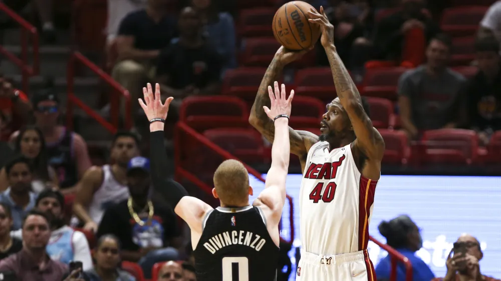 Mar 28, 2022; Miami, Florida, USA; Miami Heat forward Udonis Haslem (40) shoots over Sacramento Kings guard Donte DiVincenzo (0) during the fourth quarter of the game at FTX Arena. Mandatory Credit: Sam Navarro-USA TODAY Sports