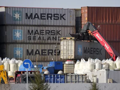 Shipping containers from the Maersk company are seen among others at a transshipment terminal in St. Petersburg, Russia, Thursday, March 24, 2022. Danish shipping company Maersk has suspended bookings for shipping to and from Ukraine, Russia and Belarus until further notice. (AP Photo)