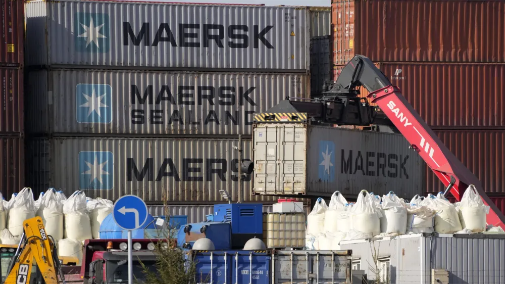 Shipping containers from the Maersk company are seen among others at a transshipment terminal in St. Petersburg, Russia, Thursday, March 24, 2022. Danish shipping company Maersk has suspended bookings for shipping to and from Ukraine, Russia and Belarus until further notice. (AP Photo)