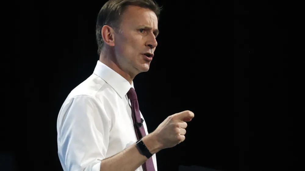 FILE - Conservative party leadership candidate Jeremy Hunt takes delivers his speech during a Conservative leadership hustings at ExCel Centre in London, Wednesday, July 17, 2019. UK leader Liz Truss has appointed former Cabinet minister Jeremy Hunt as new Treasury chief, replacing sacked Kwasi Kwarteng. Hunt is a government veteran who has served as former foreign secretary and health secretary, and ran unsuccessfully to lead the Conservative Party in 2019. (AP Photo/Frank Augstein, File)