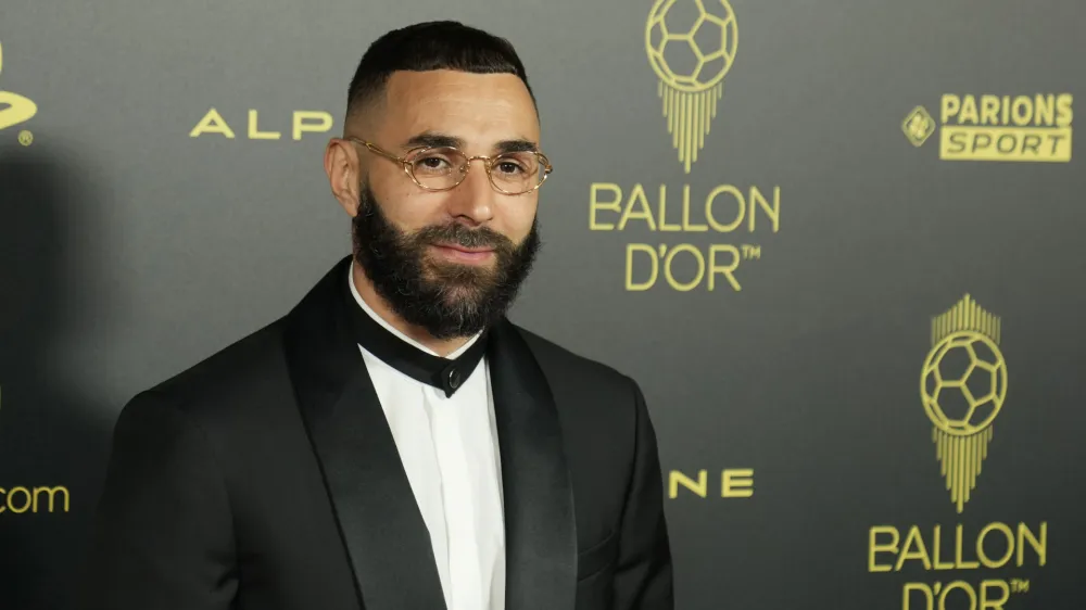 Real Madrid's Karim Benzema poses for a picture prior the 66th Ballon d'Or ceremony at Theatre du Chatelet in Paris, France, Monday, Oct. 17, 2022. (AP Photo/Francois Mori)