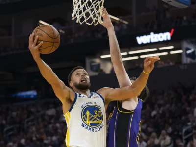 October 18, 2022; San Francisco, California, USA; Golden State Warriors guard Stephen Curry (30) shoots the basketball against Los Angeles Lakers forward Matt Ryan (37) during the second quarter at Chase Center. Mandatory Credit: Kyle Terada-USA TODAY Sports