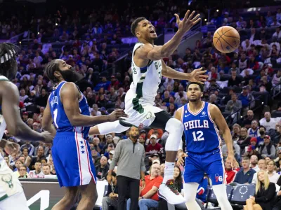 Oct 20, 2022; Philadelphia, Pennsylvania, USA; Milwaukee Bucks forward Giannis Antetokounmpo (34) looses control of the ball while driving against Philadelphia 76ers guard James Harden (1) during the third quarter at Wells Fargo Center. Mandatory Credit: Bill Streicher-USA TODAY Sports