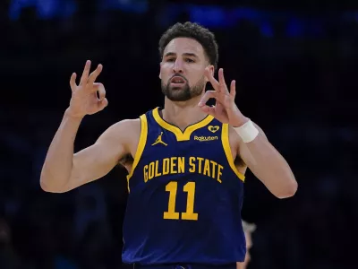 FILE - Golden State Warriors guard Klay Thompson gestures after making a 3-point basket against the Los Angeles Lakers during the second half of an NBA basketball game Tuesday, April 9, 2024, in Los Angeles. Klay Thompson is moving on from the Golden State Warriors, with the four-time league champion agreeing to join the Western Conference champion Dallas Mavericks and change franchises for the first time in his 13-year NBA career, two people with knowledge of the decision said Monday, July 1, 2024.(AP Photo/Ryan Sun)