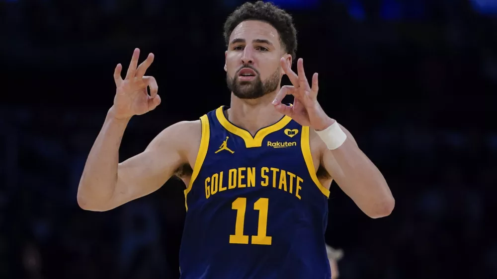 FILE - Golden State Warriors guard Klay Thompson gestures after making a 3-point basket against the Los Angeles Lakers during the second half of an NBA basketball game Tuesday, April 9, 2024, in Los Angeles. Klay Thompson is moving on from the Golden State Warriors, with the four-time league champion agreeing to join the Western Conference champion Dallas Mavericks and change franchises for the first time in his 13-year NBA career, two people with knowledge of the decision said Monday, July 1, 2024.(AP Photo/Ryan Sun)