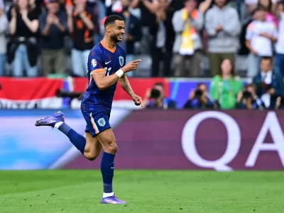 Soccer Football - Euro 2024 - Round of 16 - Romania v Netherlands - Munich Football Arena, Munich, Germany - July 2, 2024 Netherlands' Cody Gakpo celebrates scoring their first goal REUTERS/Angelika Warmuth