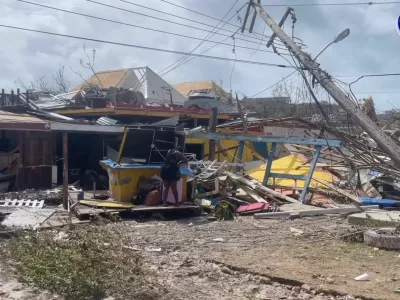 A person stands amidst damaged property following the passing of Hurricane Beryl, in Union Island, Saint Vincent and the Grenadines, in this screen grab taken from a handout video released on July 2, 2024. The Agency For Public Information St. Vincent and the Grenadines/Handout via REUTERS  THIS IMAGE HAS BEEN SUPPLIED BY A THIRD PARTY. NO RESALES. NO ARCHIVES. MANDATORY CREDIT