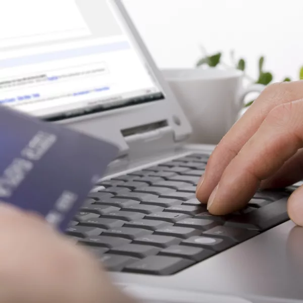 Online shopping using a credit card to complete an e-commerce transaction