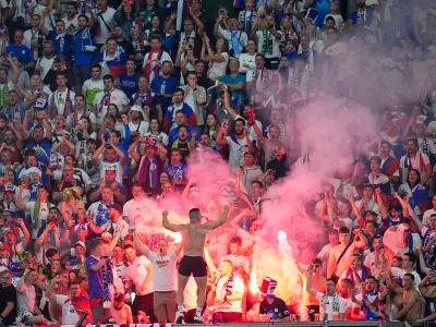 01 July 2024, Hesse, Frankfurt/Main: Slovenian fans set off pyrotechnics during the UEFA Euro 2024 round of 16 football match between Portugal and Slowenien at the Frankfurt Arena. Photo: Uwe Anspach/dpa