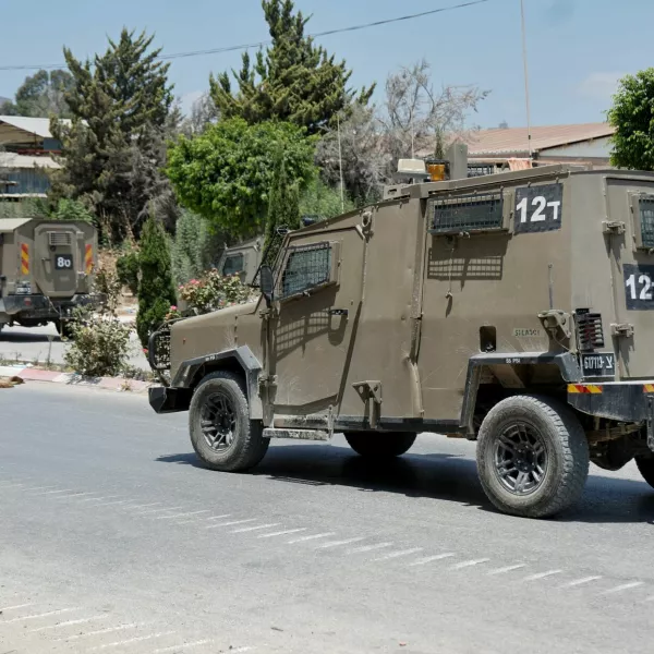 An Israeli military vehicle drives on a street after an Israeli raid at Nur Shams camp, in Tulkarm, in the Israeli-occupied West Bank, July 1, 2024. REUTERS/Raneen Sawafta