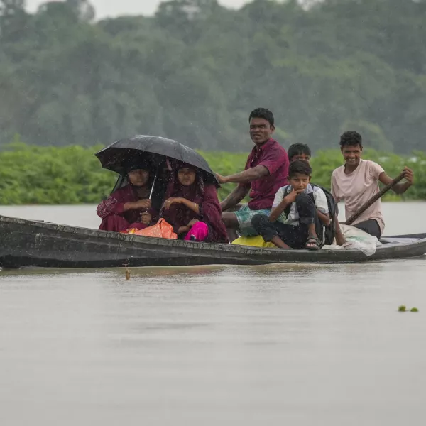 People travel on a country boat in the flood water in Morigaon district in the northeastern Indian state of Assam, India, Wednesday, July 3, 2024. (AP Photo/Anupam Nath)