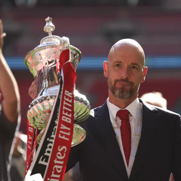 FILE - Manchester United's head coach Erik ten Hag celebrates with the trophy after winning the English FA Cup final soccer match between Manchester City and Manchester United at Wembley Stadium in London, on May 25, 2024. Manchester United manager Erik ten Hag has signed a contract extension through to 2026, the Premier League club said. (AP Photo/Ian Walton)