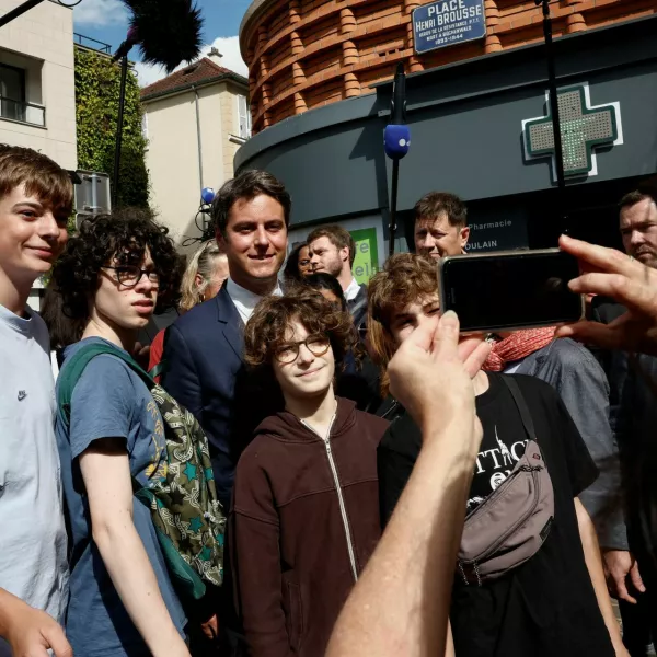 French Prime Minister Gabriel Attal poses for a picture, after Ensemble Pour La Republique candidate and French Government spokesperson Prisca Thevenot and her team were targeted by an unidentified group of youth while they were out putting up campaign posters prior to the second round of the early French parliamentary elections, in Meudon-la-Foret, near Paris, France, July 4, 2024. REUTERS/Benoit Tessier