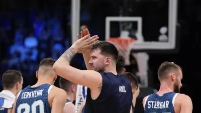 Slovenia's Luka Doncic applauds following an Acropolis tournament basketball match against Greece at the Peace and Friendship indoor stadium at Athens' port city of Piraeus, Greece, Saturday, July 6, 2024. (AP Photo/Petros Giannakouris)