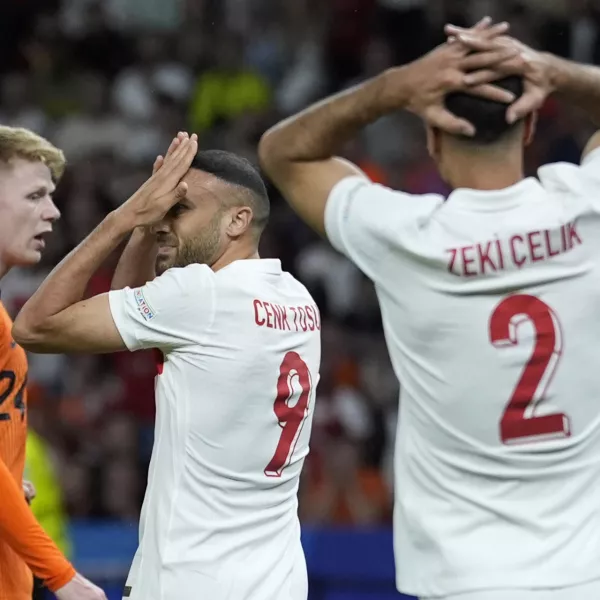 Turkey's Cenk Tosun, center, reacts during a quarterfinal match between the Netherlands and Turkey at the Euro 2024 soccer tournament in Berlin, Germany, Saturday, July 6, 2024. (AP Photo/Ariel Schalit)