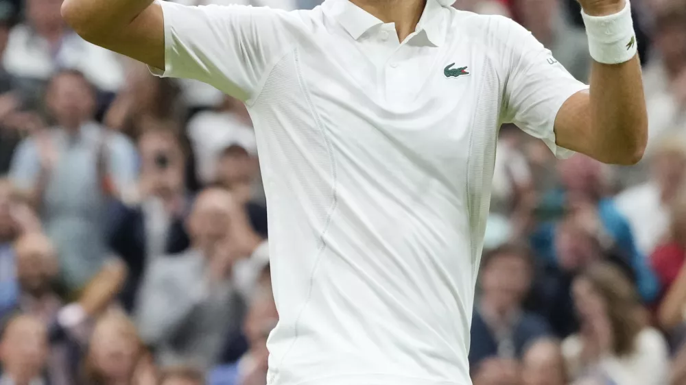 Novak Djokovic of Serbia reacts after defeating Alexei Popyrin of Australia in their third round match at the Wimbledon tennis championships in London, Saturday, July 6, 2024. (AP Photo/Kirsty Wigglesworth)