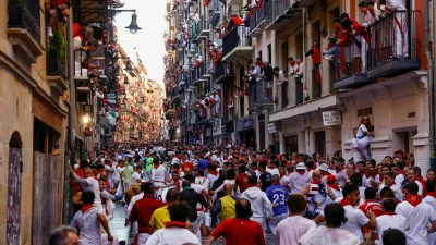 Revellers sprint during the running of the bulls at the San Fermin festival in Pamplona, Spain, July 7, 2024. REUTERS/Susana Vera