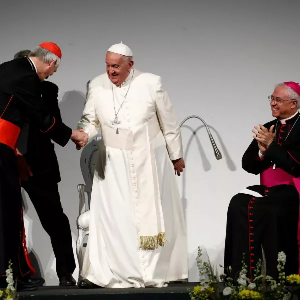 Pope Francis shakes hands with Cardinal Matteo Zuppi on the day of the 50th Social Week of Catholics at the "Generali Convention Center" in Trieste, Italy, July 7, 2024. REUTERS/Alessandro Garofalo