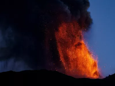 Lava and smoke rise from a crater of Mount Etna, Europe's most active volcano, Italy July 4, 2024. REUTERS/Etna Walk/Giuseppe Di Stefano