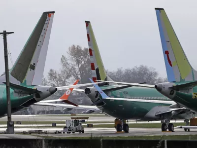 ﻿FILE- In this Nov. 14, 2018, file photo Boeing 737 MAX 8 planes are parked near Boeing Co.'s 737 assembly facility in Renton, Wash. Investigators were rushing to the scene of a devastating plane crash in Ethiopia on Sunday, March 10, 2019, an accident that could renew safety questions about the newest version of Boeing's popular 737 airliner. (AP Photo/Ted S. Warren, File)